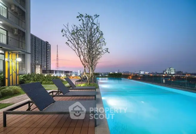 Luxurious rooftop pool with stunning city skyline view at sunset