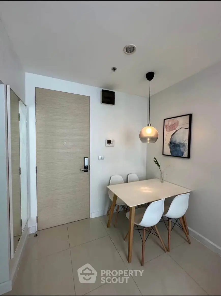 Modern dining area with minimalist decor and stylish lighting