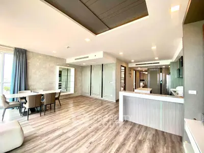 Spacious modern living room with open kitchen and elegant dining area