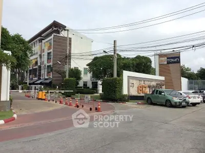 Modern commercial building with parking and secure entrance in prime location.