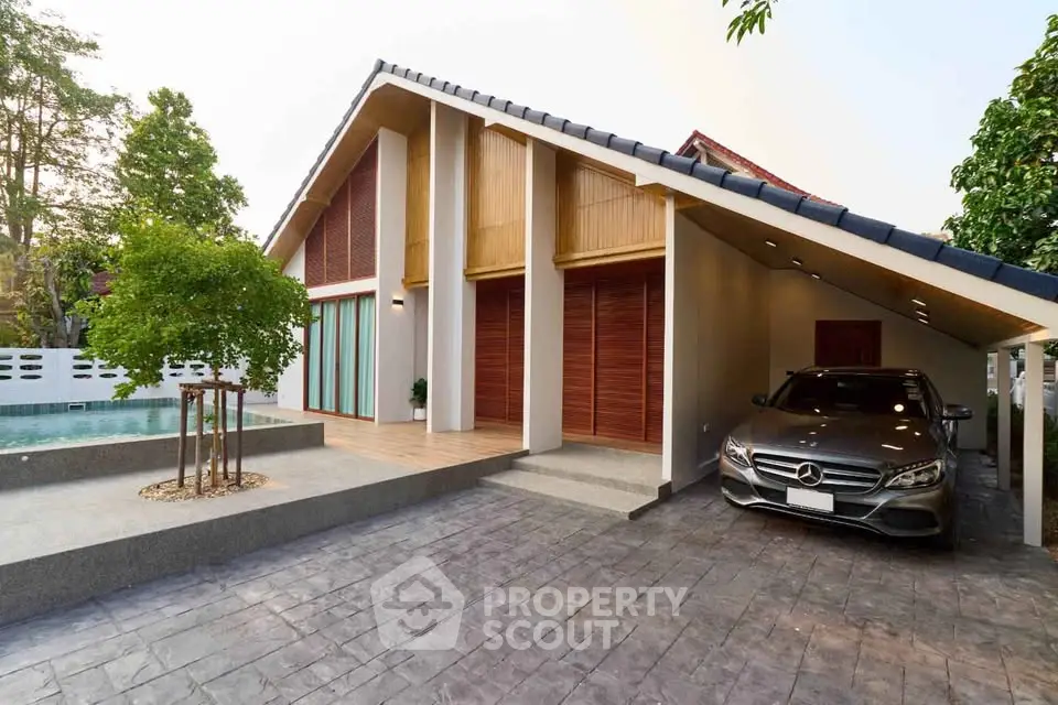 Modern house with sleek carport and inviting poolside area, perfect for luxury living.