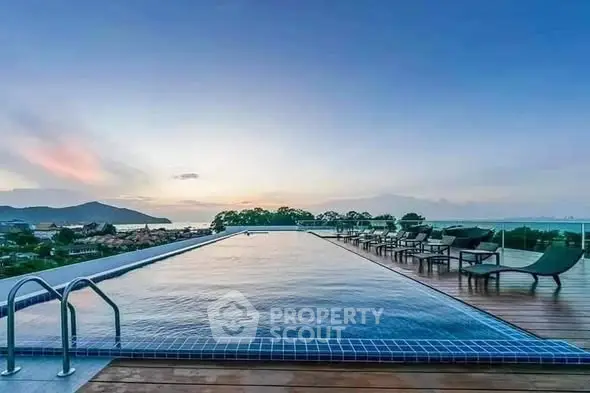 Stunning rooftop infinity pool with breathtaking ocean view at sunset.