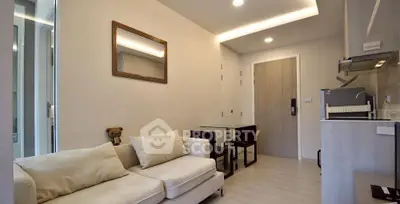 Modern living room with cozy sofa and dining area in stylish apartment.