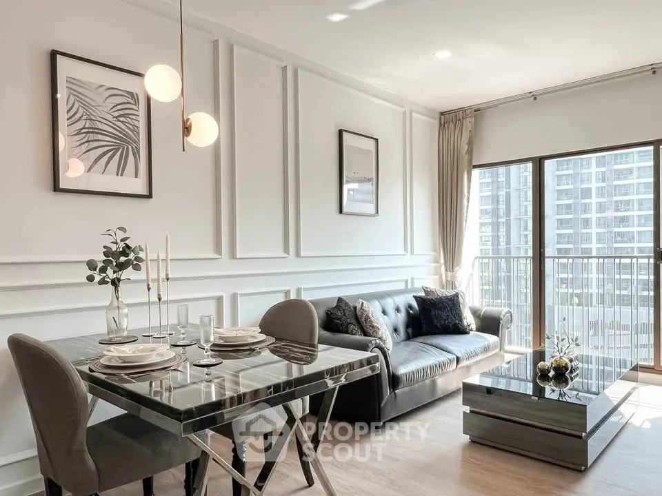 Modern living room with elegant decor and large windows offering city views
