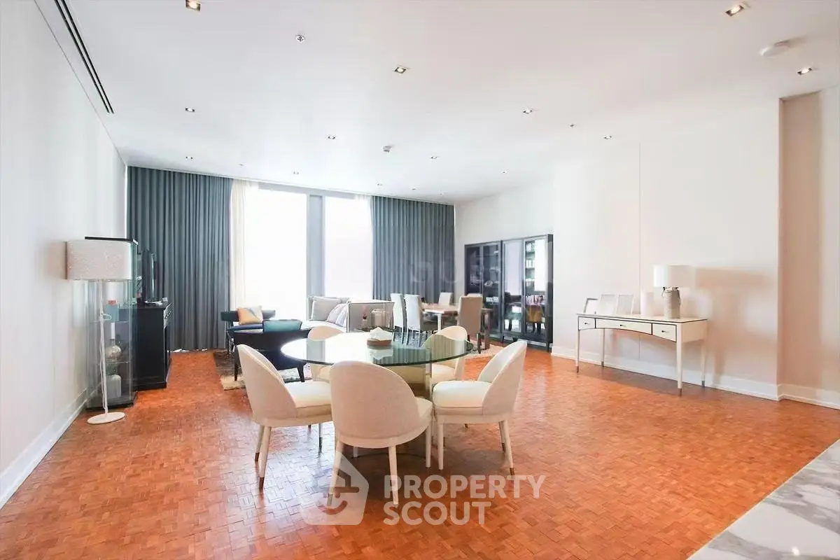 Spacious and elegant living room with modern furniture and large windows