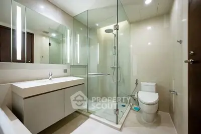 Luxurious modern bathroom with glass shower and sleek fixtures