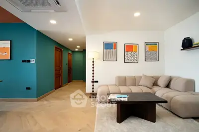 Modern living room with stylish decor and cozy beige sofa in a contemporary apartment.