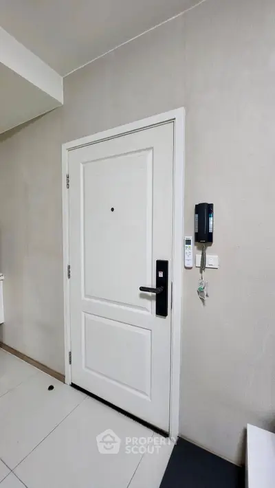 Modern apartment entrance with secure door and intercom system
