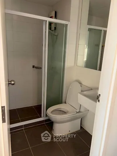 Modern bathroom with glass shower and sleek toilet design
