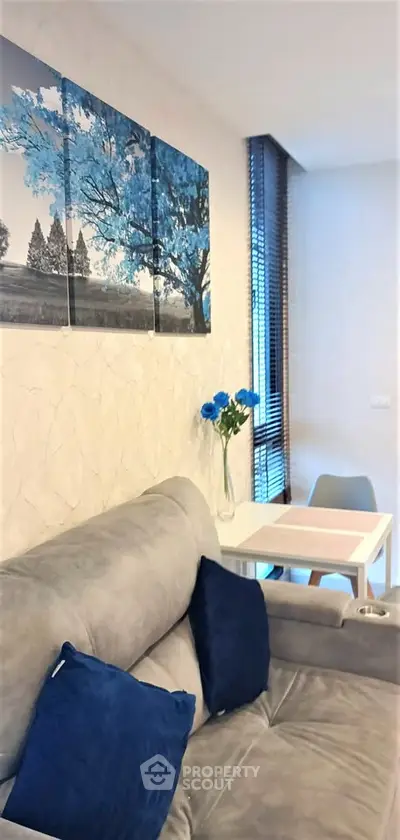 Modern living room with stylish decor and cozy seating area, perfect for relaxation and entertaining.