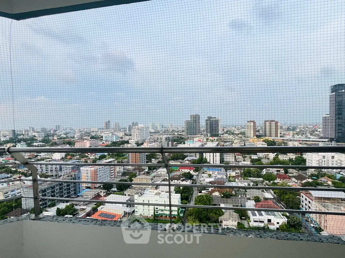 Stunning cityscape view from high-rise balcony with modern railing