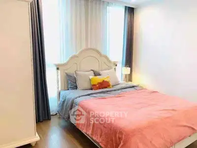 Cozy bedroom with elegant bed and soft lighting, perfect for relaxation.