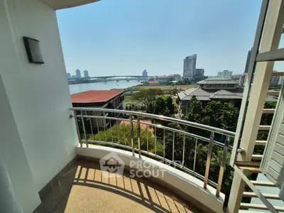 Stunning balcony view overlooking river and city skyline, perfect for urban living.