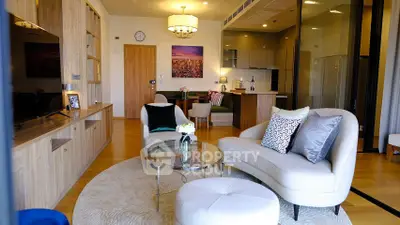 Modern living room with stylish furniture and open kitchen layout