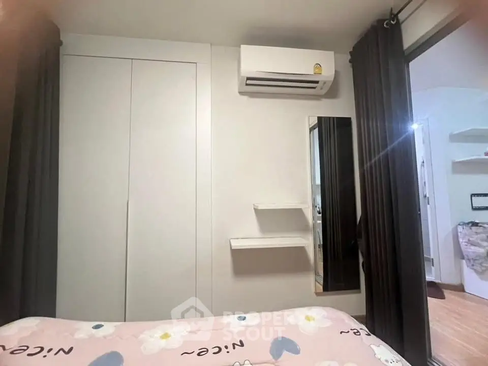 Cozy bedroom with air conditioning and modern decor in a stylish apartment.