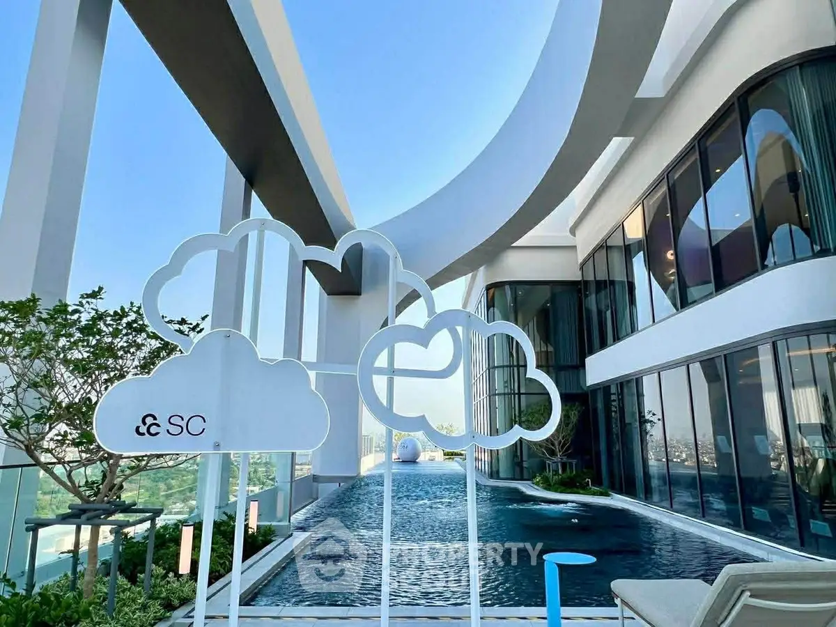 Luxurious modern building with stunning rooftop pool and panoramic views.