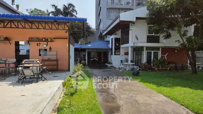 Charming residential property with spacious garden and modern exterior design, perfect for family living.