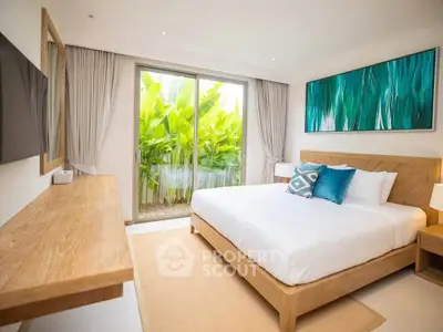 Luxurious bedroom with modern decor and garden view, featuring a cozy bed and stylish artwork.