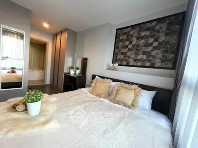 Luxurious bedroom with stylish decor and cozy ambiance, featuring a plush bed and elegant wall art.
