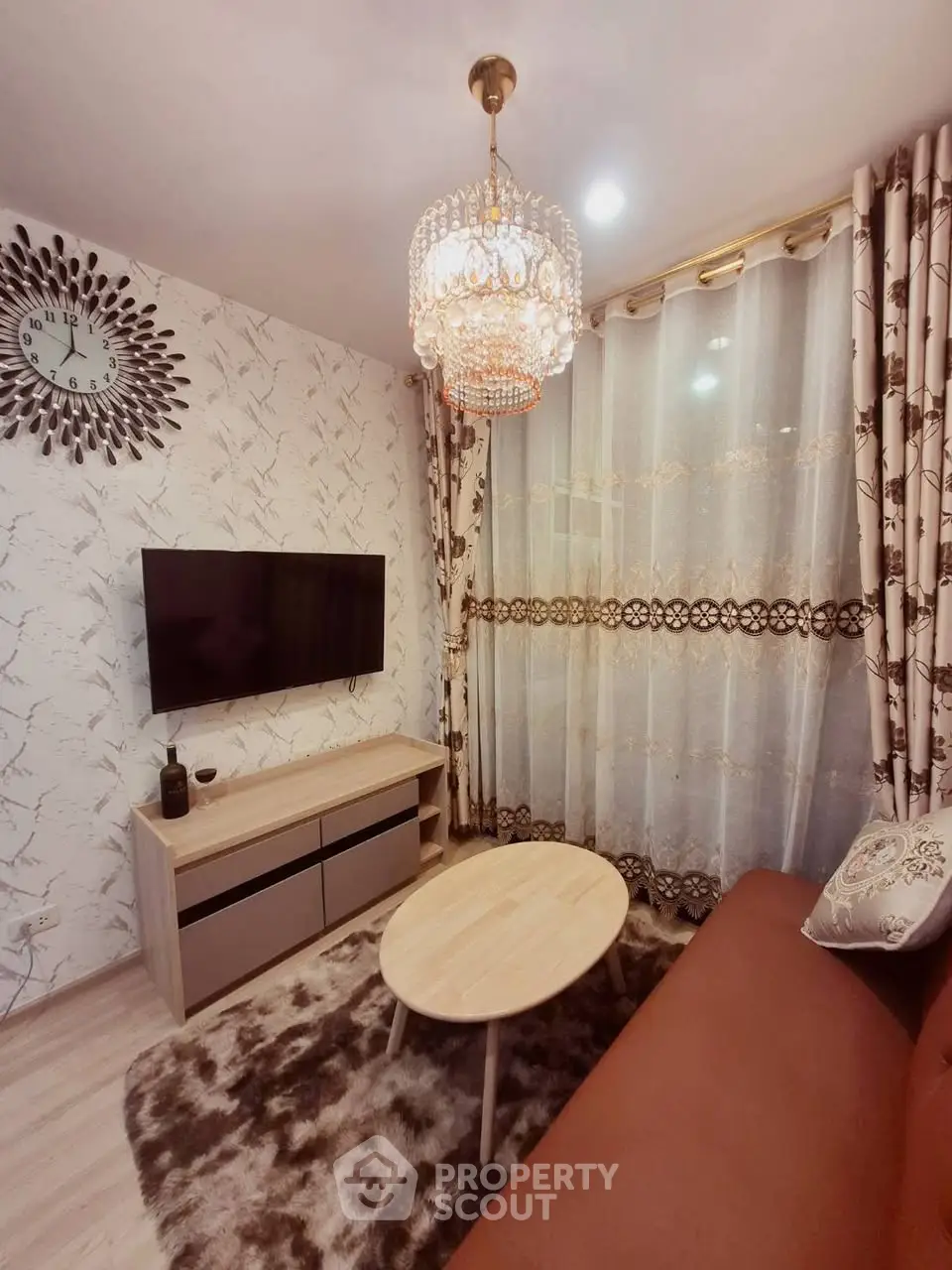 Elegant living room with chic chandelier and modern decor