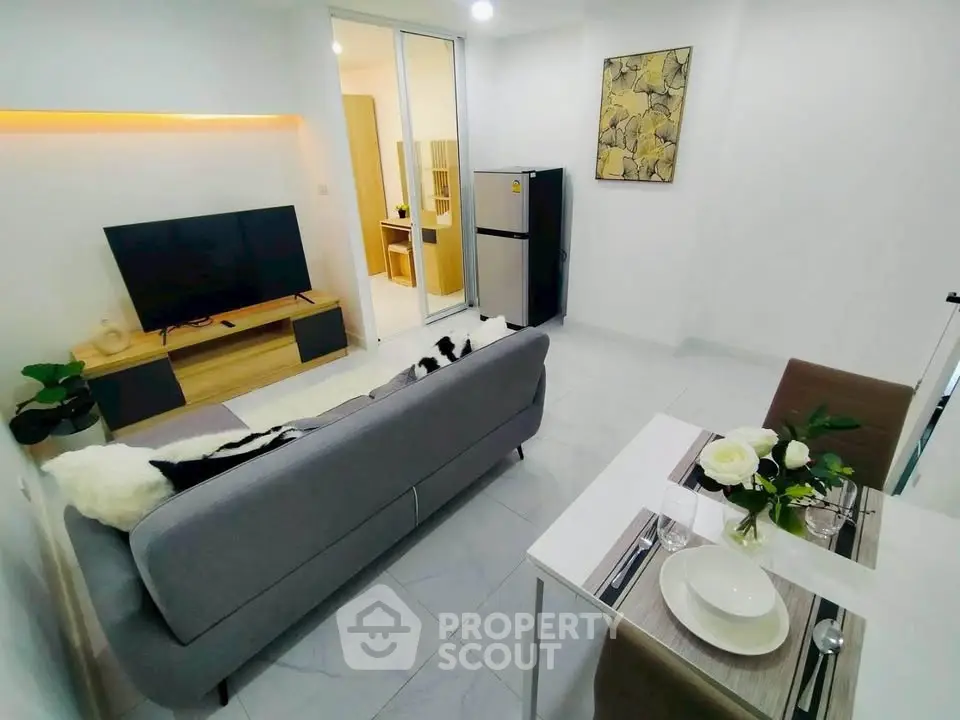 Modern living room with sleek furniture and open layout, perfect for urban living.