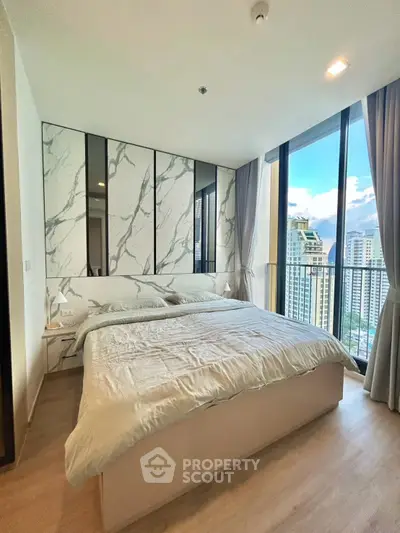 Luxurious bedroom with stunning city view and modern decor