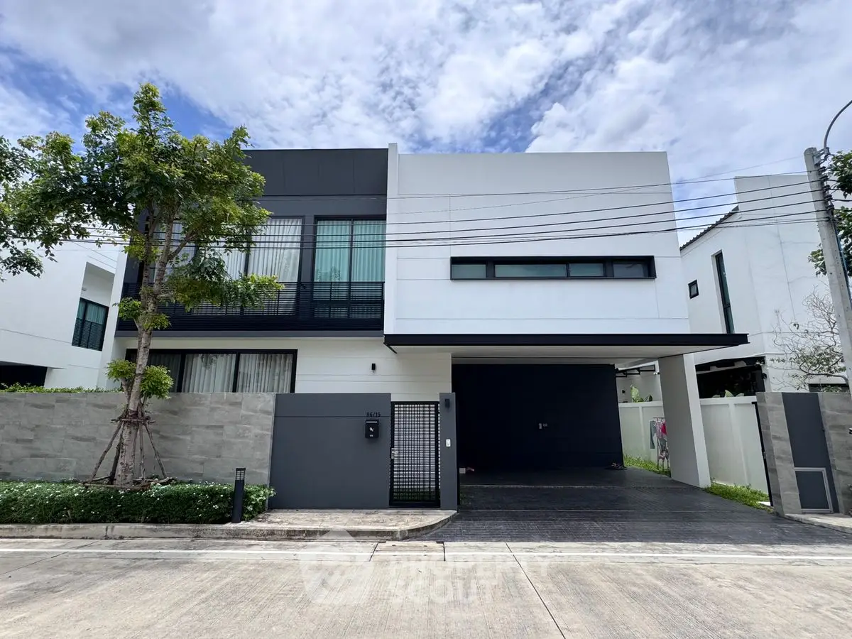 Modern two-story house with sleek design and spacious driveway