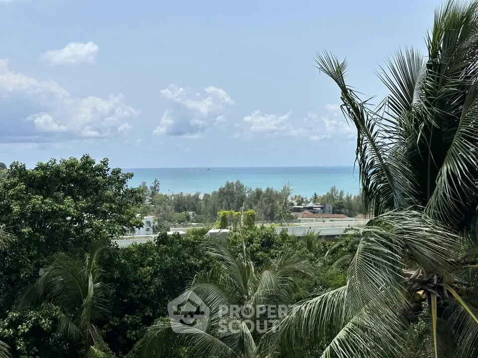 Stunning ocean view from a lush tropical setting, perfect for serene living.