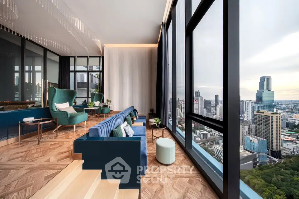 Luxurious high-rise living room with panoramic city views and elegant decor.