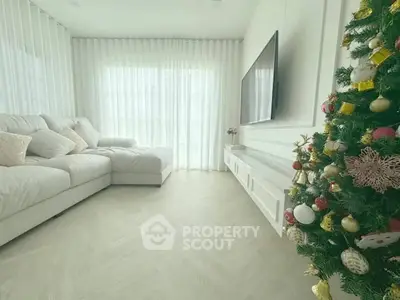 Bright living room with Christmas tree and modern decor