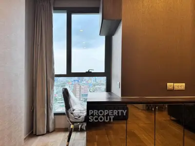 Modern study area with city view, featuring sleek wooden flooring and contemporary design.