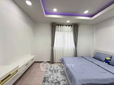 Modern bedroom with cozy bed, elegant curtains, and ambient lighting.
