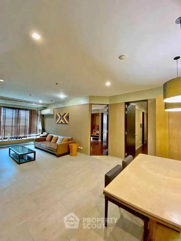 Spacious modern living room with elegant decor and ample natural light