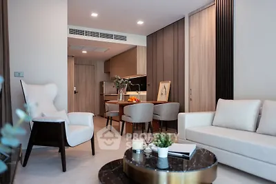 Modern living room with elegant furniture and open kitchen layout