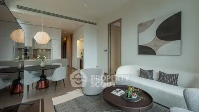 Modern living room with open kitchen, stylish decor, and contemporary furniture in a luxury apartment.