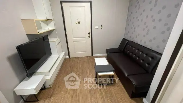 Modern living room with sleek furniture and stylish decor, perfect for urban living.
