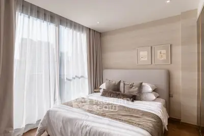 Elegant bedroom with large window and stylish decor in modern apartment