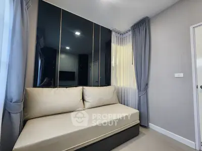 Modern living room with sleek sofa and elegant curtains