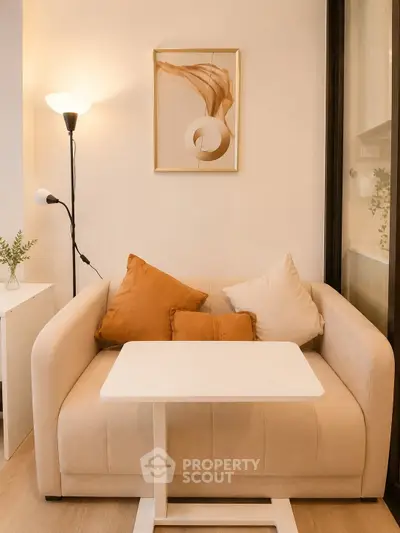 Cozy living room with modern decor and stylish sofa in a well-lit apartment.