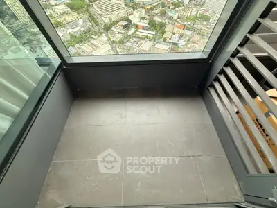 Stunning high-rise balcony with breathtaking cityscape view, perfect for urban living enthusiasts.