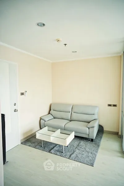 Modern living room with sleek sofa and stylish coffee table