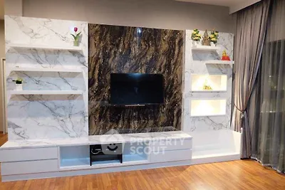 Luxurious living room with elegant marble TV wall and modern decor