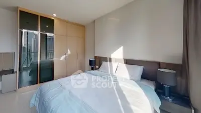 Modern bedroom with sleek wardrobe and city view, perfect for urban living.