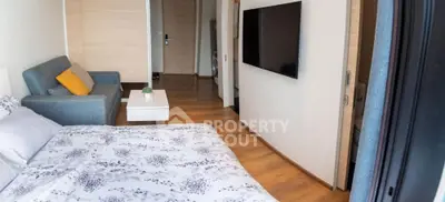 Modern studio apartment with cozy living area and stylish decor