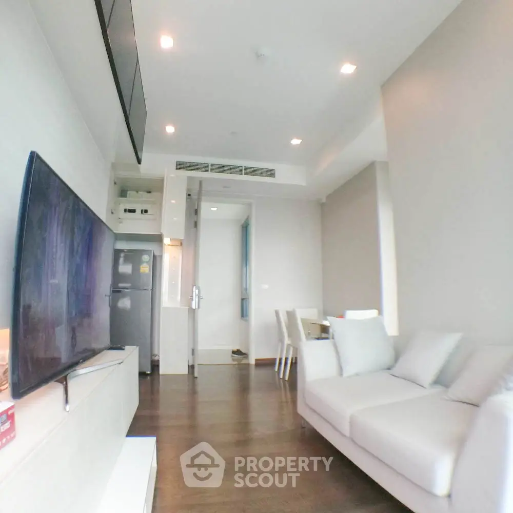 Modern living room with sleek design and cozy seating area