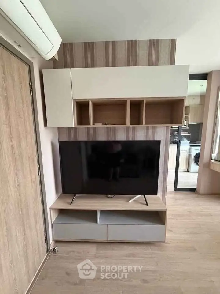 Modern living room with sleek TV unit and stylish decor, perfect for contemporary living.