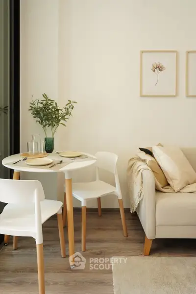 Cozy living room with modern dining set and elegant decor