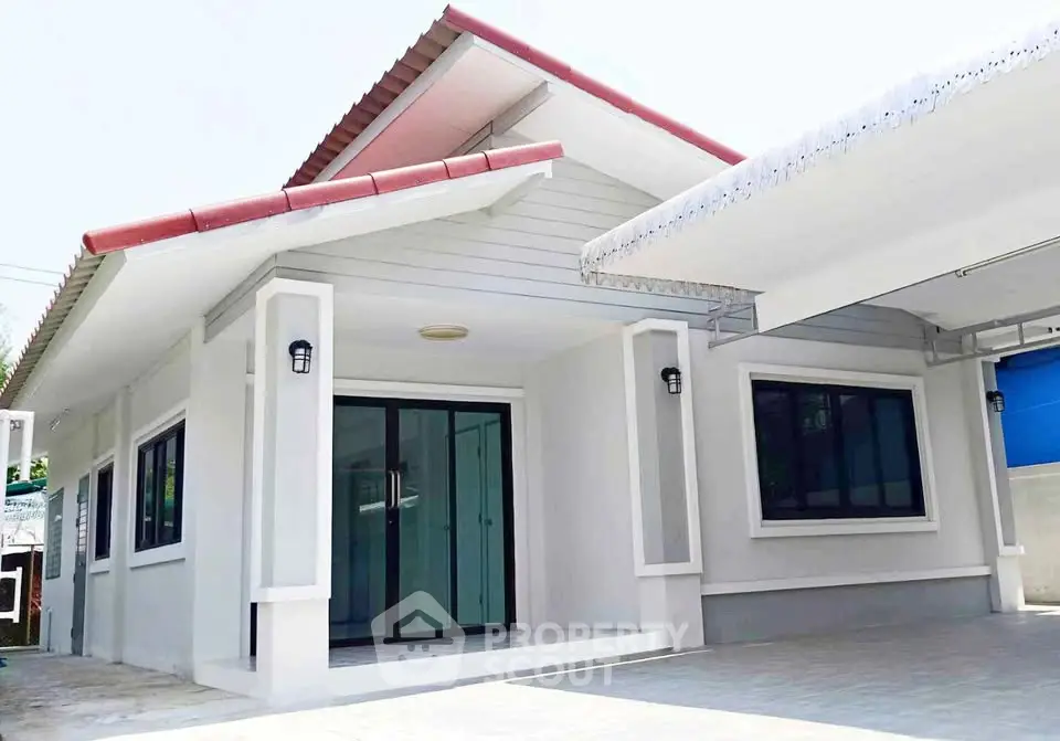 Charming single-story home with modern design and spacious driveway