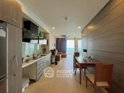 Modern open-layout kitchen and dining area with stylish decor and ample natural light.