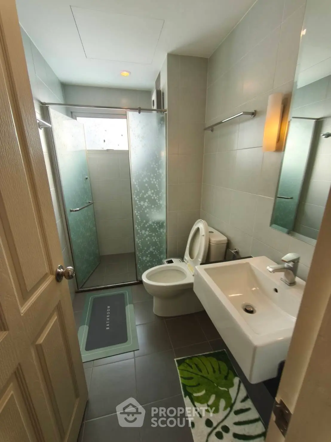 Modern bathroom with glass shower and sleek fixtures